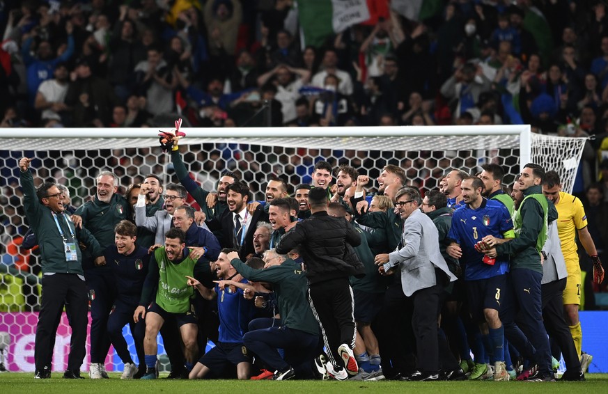 Italy&#039;s team celebrate after winning the Euro 2020 soccer championship semifinal match between Italy and Spain at Wembley Stadium in London, Tuesday, July 6, 2021. (Andy Rain/Pool via AP)