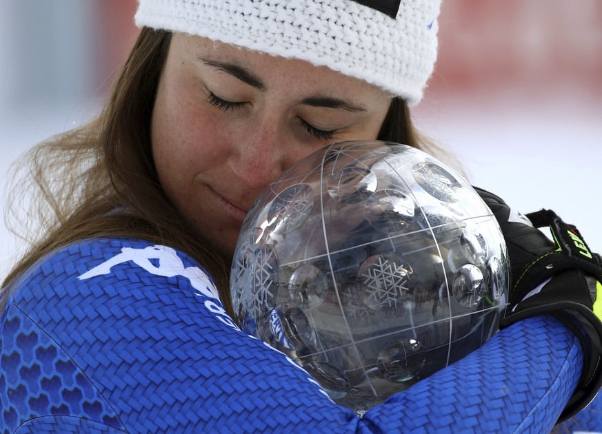 Italy&#039;s Sofia Goggia holds the women&#039;s World Cup downhill discipline trophy, at the alpine ski World Cup finals in Are, Sweden, Wednesday, March 14, 2018. (AP Photo/Marco Trovati)