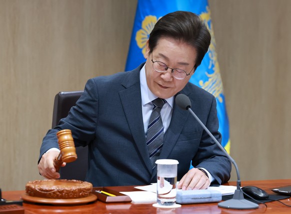 epa12193702 President Lee Jae Myung bangs the gavel to open a Cabinet meeting at the presidential office in Seoul, South Korea, 24 June 2025. EPA/YONHAP SOUTH KOREA OUT