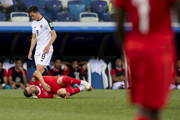 Switzerland&#039;s midfielder Xherdan Shaqiri, reacts next to Costa Rica&#039;s defender Bryan Oviedo during the FIFA World Cup 2018 group E preliminary round soccer match between Switzerland and Cost ...