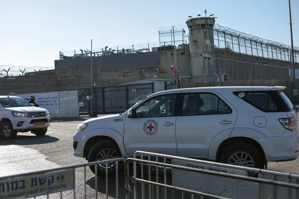 epa11862879 The International Committee of the Red Cross (ICRC) arrives to the West Bank military prison of Ofer, north of Jerusalem, 30 January 2025. Israel is expected to release Palestinian prisone ...