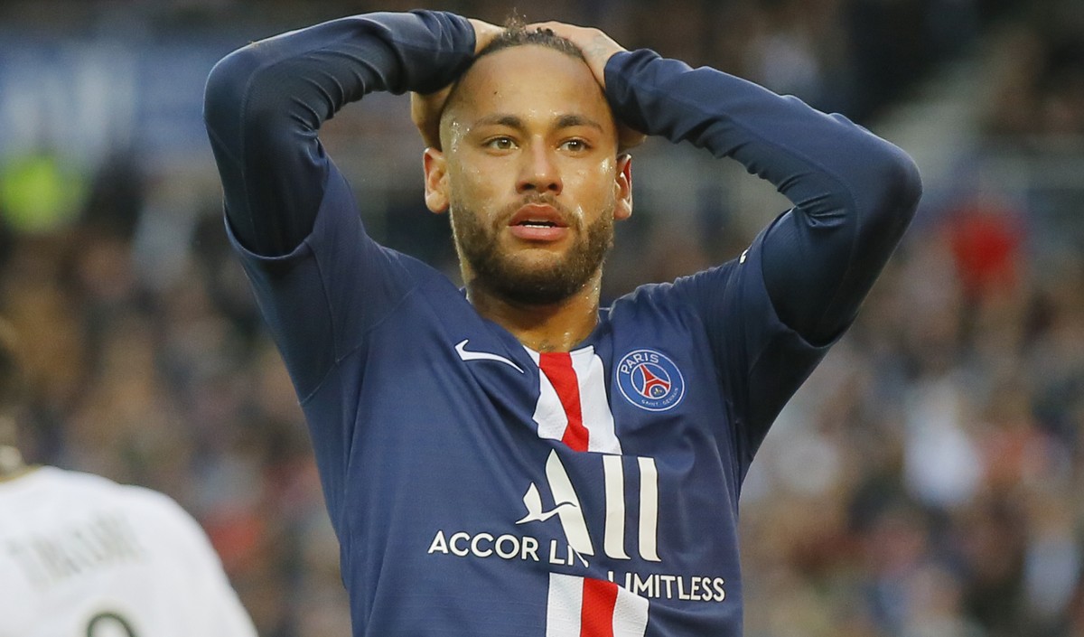 PSG's Neymar react after missing a goal opportunity during French League One soccer match between PSG and Angers at the Parc des Princes stadium in Paris, Saturday, Oct. 5, 2019. (AP Photo/Michel ...