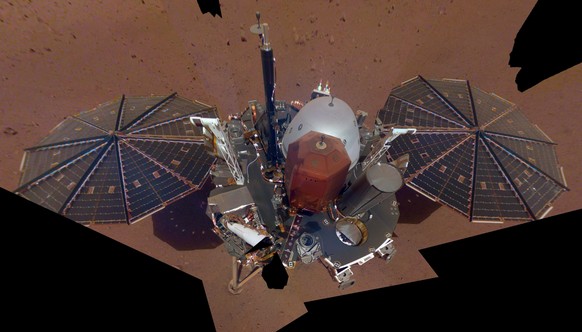 FILE - This Dec. 6, 2018 image made available by NASA shows the InSight lander. The scene was assembled from 11 photos taken using its robotic arm. The spacecraft is losing power because of all the du ...