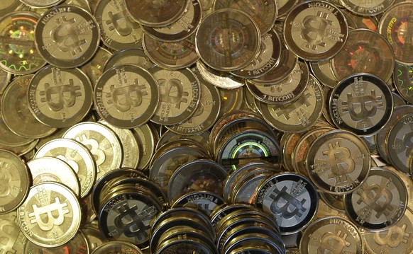 FILE - This April 3, 2013 file photo, shows bitcoin tokens at 35-year-old software engineer Mike Caldwell&#039;s shop in Sandy, Utah. Mexico&#039;s Central Bank issued a public warning Monday, June 28 ...
