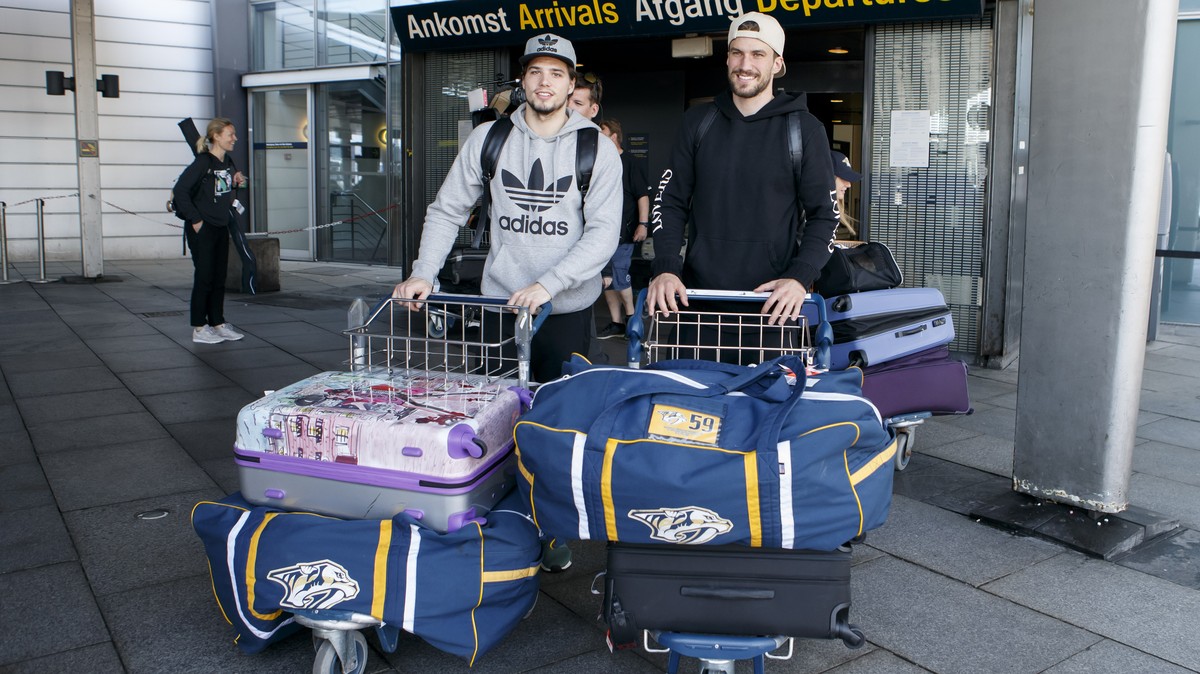 Switzerland's players forward Kevin Fiala, left, and defender Roman Josi, right, arrive to airport for take part to the IIHF 2018 World Championship, in Copenhagen, Denmark, Sunday, May 13, 2018. ...