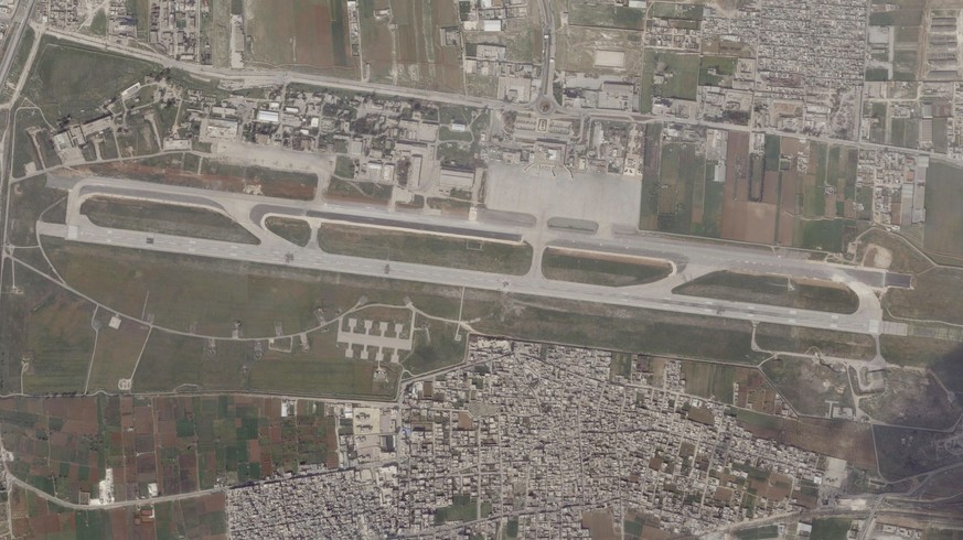 This satellite image from Planet Labs PBC shows damage on the runway of Aleppo International Airport after a suspected Israeli strike there in Aleppo, Syria, Tuesday, March 7, 2023. A suspected Israel ...