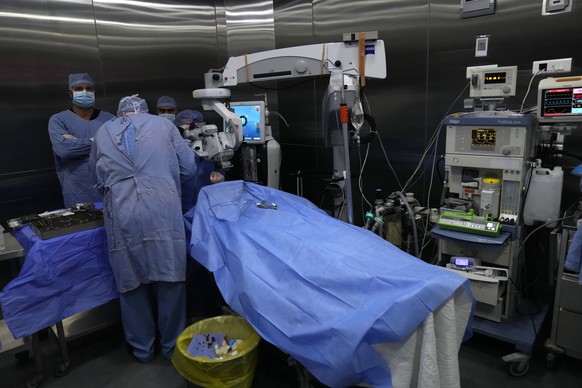 Doctors make an eye surgery operation on a man who was injured in the explosion of one of the handheld devices, at the Eye Specialist hospital, in Beirut, Lebanon, Friday, Sept. 20, 2024. (AP Photo/Hu ...
