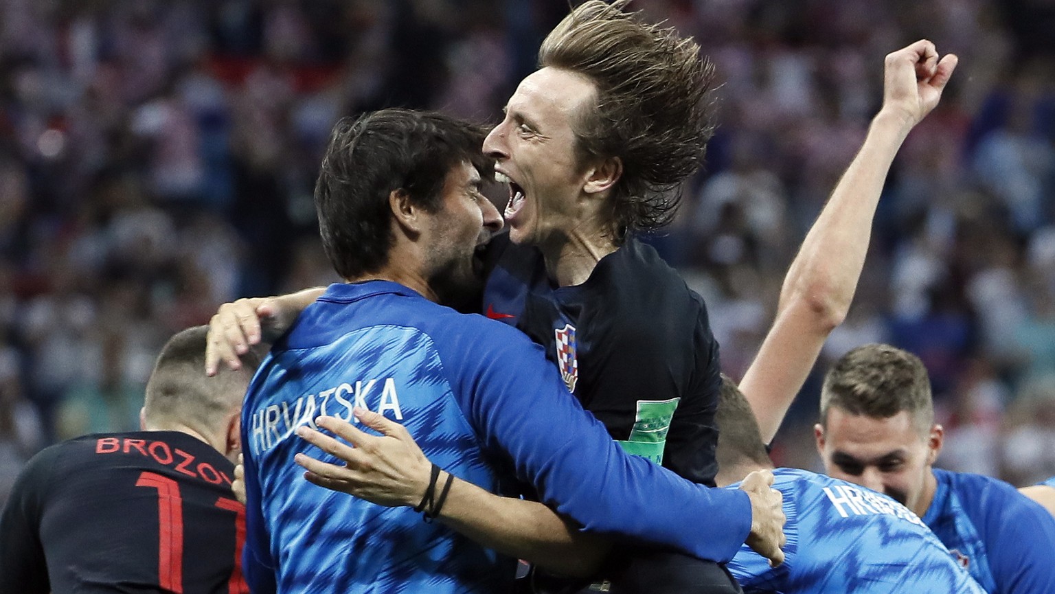 epa06856725 Luka Modric (R) of Croatia celebrates after the FIFA World Cup 2018 round of 16 soccer match between Croatia and Denmark in Nizhny Novgorod, Russia, 01 July 2018. Croatia won the match 3-2 ...