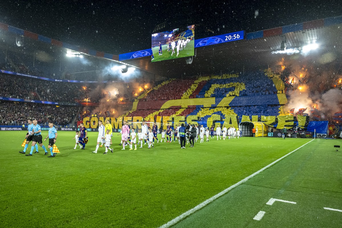 The teams enter the pitch before the UEFA Champions League play-off first leg match between Switzerland's FC Basel 1893 and Denmark's F.C. Copenhagen at the St. Jakob-Park stadium in Basel,  ...