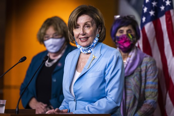 epa09213335 Speaker of the House Nancy Pelosi speaks at a news conference on the Democrats push for a bipartisan 9/11-style commission to investigate the January 6th attack on the US Capitol, inside t ...