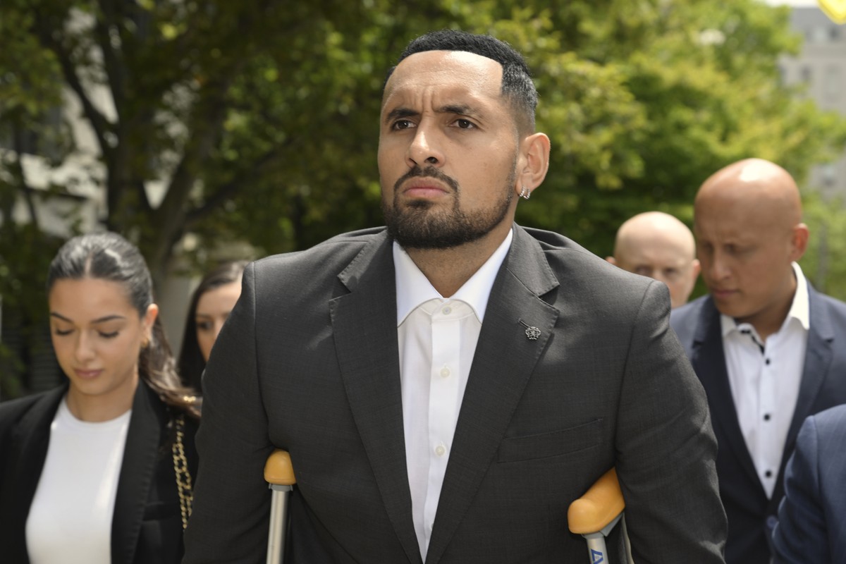 Australian tennis player Nick Kyrgios arrives at the ACT Magistrates Court in Canberra, Friday, Feb. 3, 2023. Kyrgios has pleaded guilty in an Australian court to assaulting a former girlfriend during ...