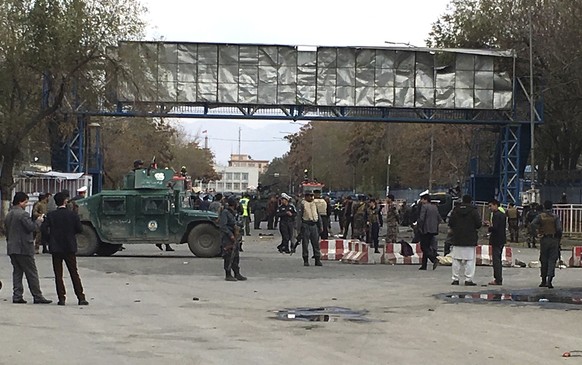 Security forces inspect the site of a suicide attack in the capital of Kabul, Afghanistan, Monday, Nov. 12, 2018. Afghan officials confirm at least three people killed in a blast happened near a high  ...