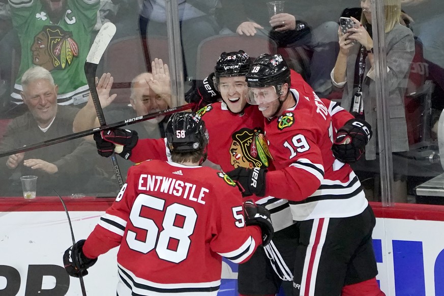 Chicago Blackhawks&#039; Philipp Kurashev, center, celebrates his goal with Jonathan Toews (19) and MacKenzie Entwistle during the second period of an NHL hockey game against the Florida Panthers Tues ...