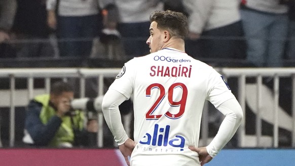 Lyon&#039;s Xherdan Shaqiri stands in front of supporters after Marseille&#039;s Dimitri Payet was injured by an object thrown by a Lyon&#039;s supporter during the French League One soccer match betw ...