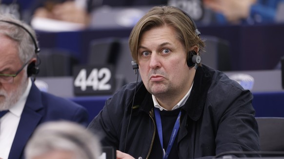FILE - Germany&#039;s Maximilian Krah, of the far-right &#039;Alternative for Germany&#039; party, grimaces during a session at the European Parliament in Strasbourg, France, Tuesday, April 23, 2024.  ...