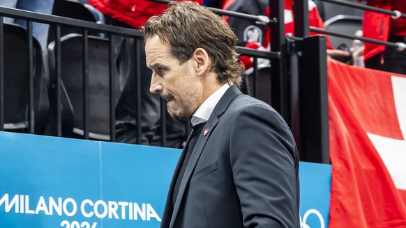 Patrick Fischer, head coach of Switzerland national ice hockey team, looks disappointed as they leave his bench after the second period, during the men's group A preliminary round game between Ca ...