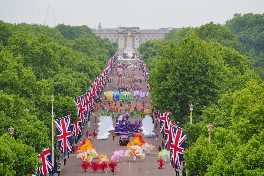 Performers parade down The Mall during the Platinum Jubilee Pageant outside Buckingham Palace in London, Sunday June 5, 2022, on the last of four days of celebrations to mark the Platinum Jubilee. The ...