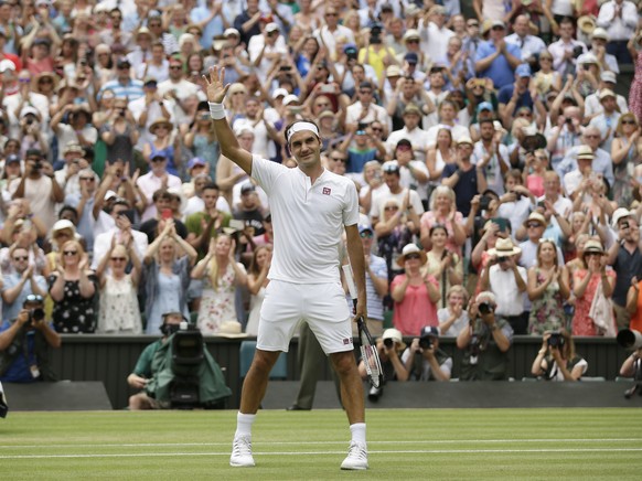 Roger Federer of Switzerland celebrates defeating France&#039;s Adrian Mannarino in their men&#039;s singles match, on day seven of the Wimbledon Tennis Championships, in London, Monday July 9, 2018.  ...