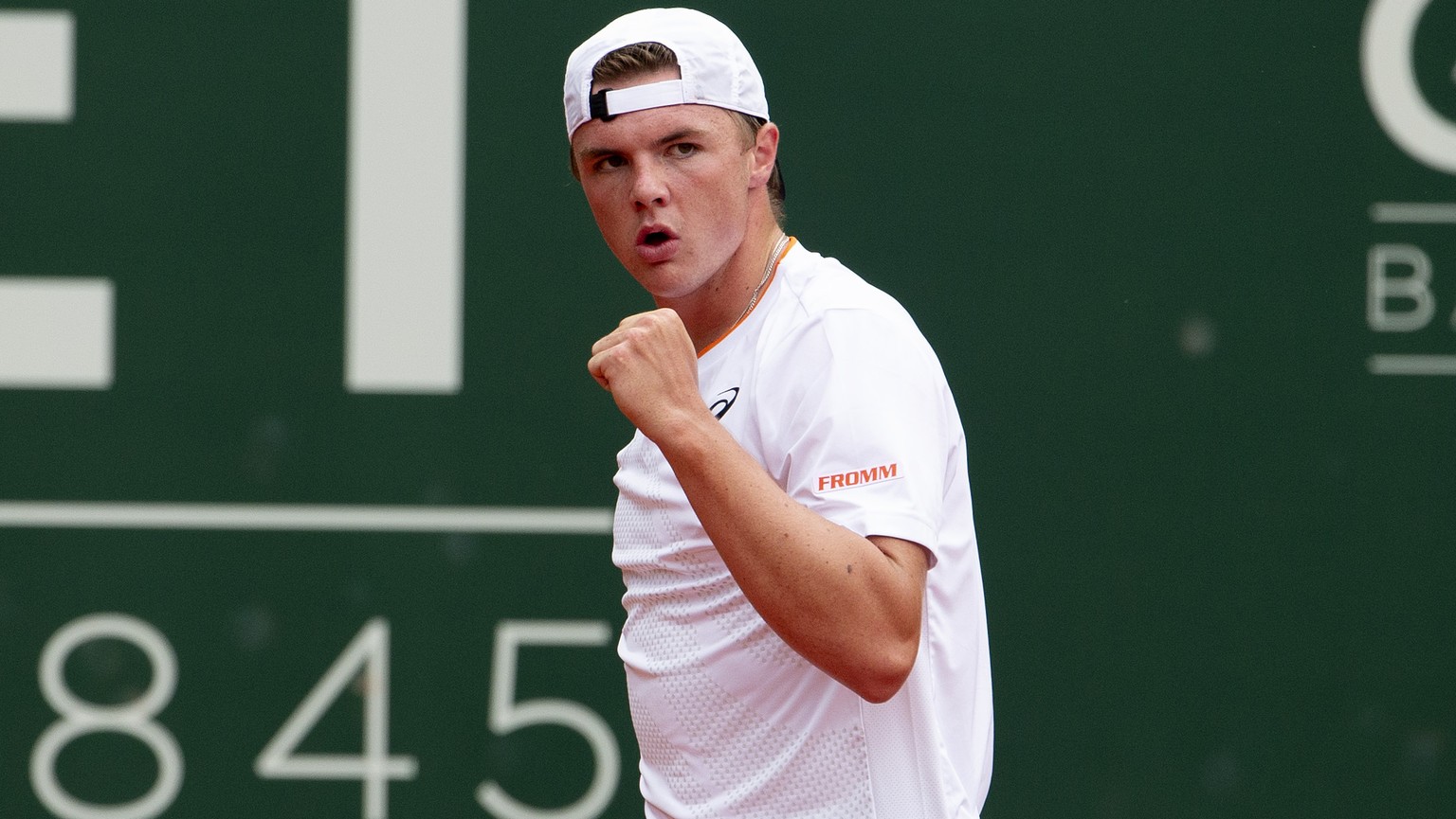 Dominic Stephan Stricker, of Switzerland, reacts after wining a game against Marin Cilic, of Croatia, during their first round match, during their first round match, at the ATP 250 Geneva Open tournam ...