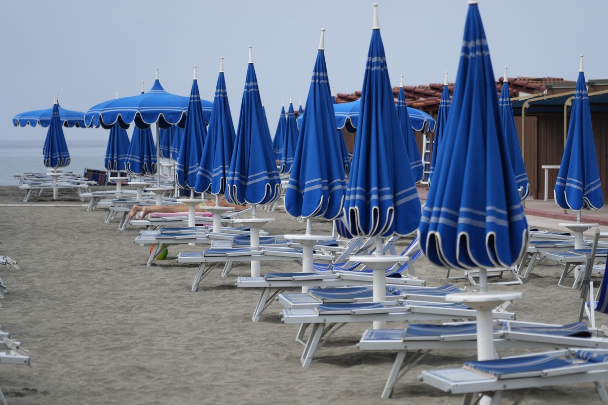 Umbrellas and sun beds are set at the Venezia beach establishment in Ostia, near Rome, Friday, Aug. 16, 2024. (AP Photo/Gregorio Borgia)