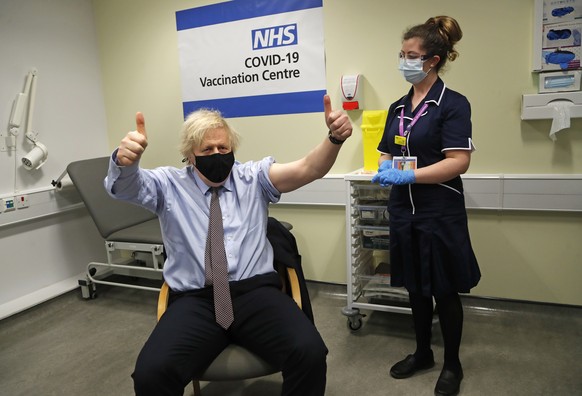 FILE - In this Friday, March 19, 2021 file photo Britain&#039;s Prime Minister Boris Johnson gestures after receiving the first dose of the AstraZeneca vaccine administered by nurse and Clinical Pod L ...