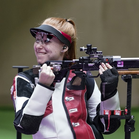 Nina Christen, of Switzerland, reacts after the last shot in the women&#039;s 50-meter 3 positions rifle at the Asaka Shooting Range in the 2020 Summer Olympics, Saturday, July 31, 2021, in Tokyo, Jap ...