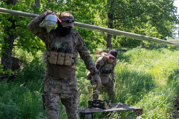 Ukrainian servicemen of Khartia brigade launch a drone towards Russian positions at the front line in the Kharkiv region, Ukraine, Wednesday, May 20, 2026. (AP Photo/Andrii Marienko)
Russia Ukraine Wa ...