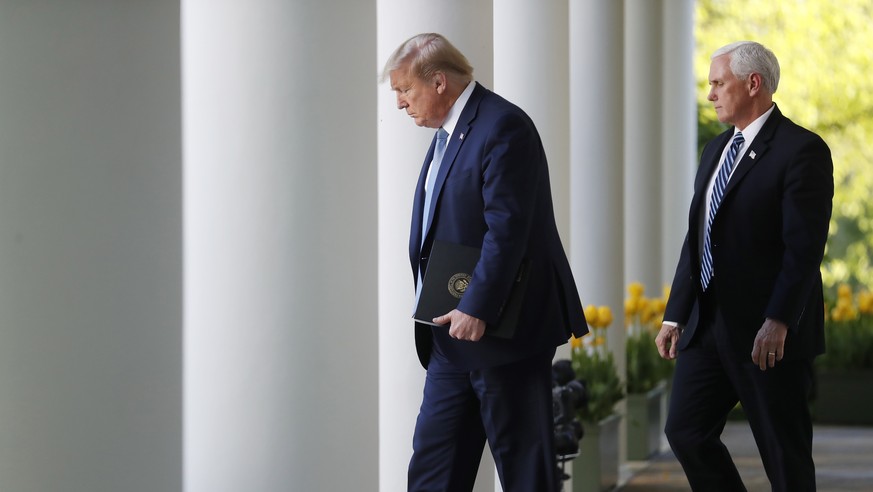 epa08931303 (FILE) - US President Donald J. Trump arrives with Vice President Mike Pence for the Coronavirus Task Force briefing to deliver remarks on the COVID-19 pandemic in the Rose Garden at the W ...