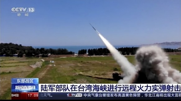 In this image taken from video footage run by China&#039;s CCTV, a projectile is launched from an unspecified location in China, Thursday, Aug. 4, 2022. China says it conducted &quot;precision missile ...