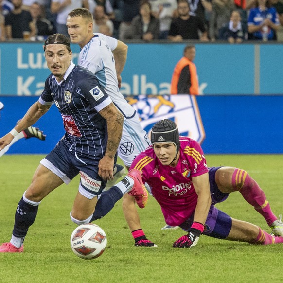 Kevin Spadanuda, left, from Luzern and keeper Jacob Widell Zetterstrom, right, from Djurgardens play at the Conference League game between Switzerlands`s FC Luzern against Djurgardens IF from Sweden a ...