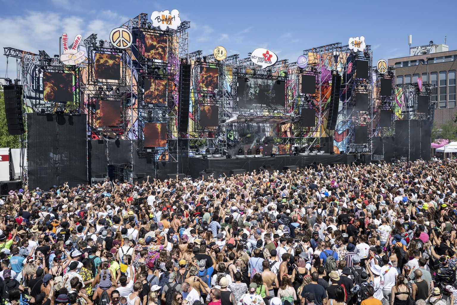 Thousands of participants dancing through the streets during the 29th Street Parade in the city center of Zurich, Switzerland, Saturday, August 13, 2022. The annual dance music event Street Parade run ...