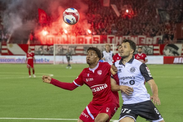 Ethan Meichtry, links, von Thun im Spiel gegen Anto Grgic, rechts, von Lugano beim Super League Meisterschaftsspiel zwischen dem FC Thun und dem FC Luganovom Samstag, 25. Maerz 2026 in Thun. (KEYSTONE ...