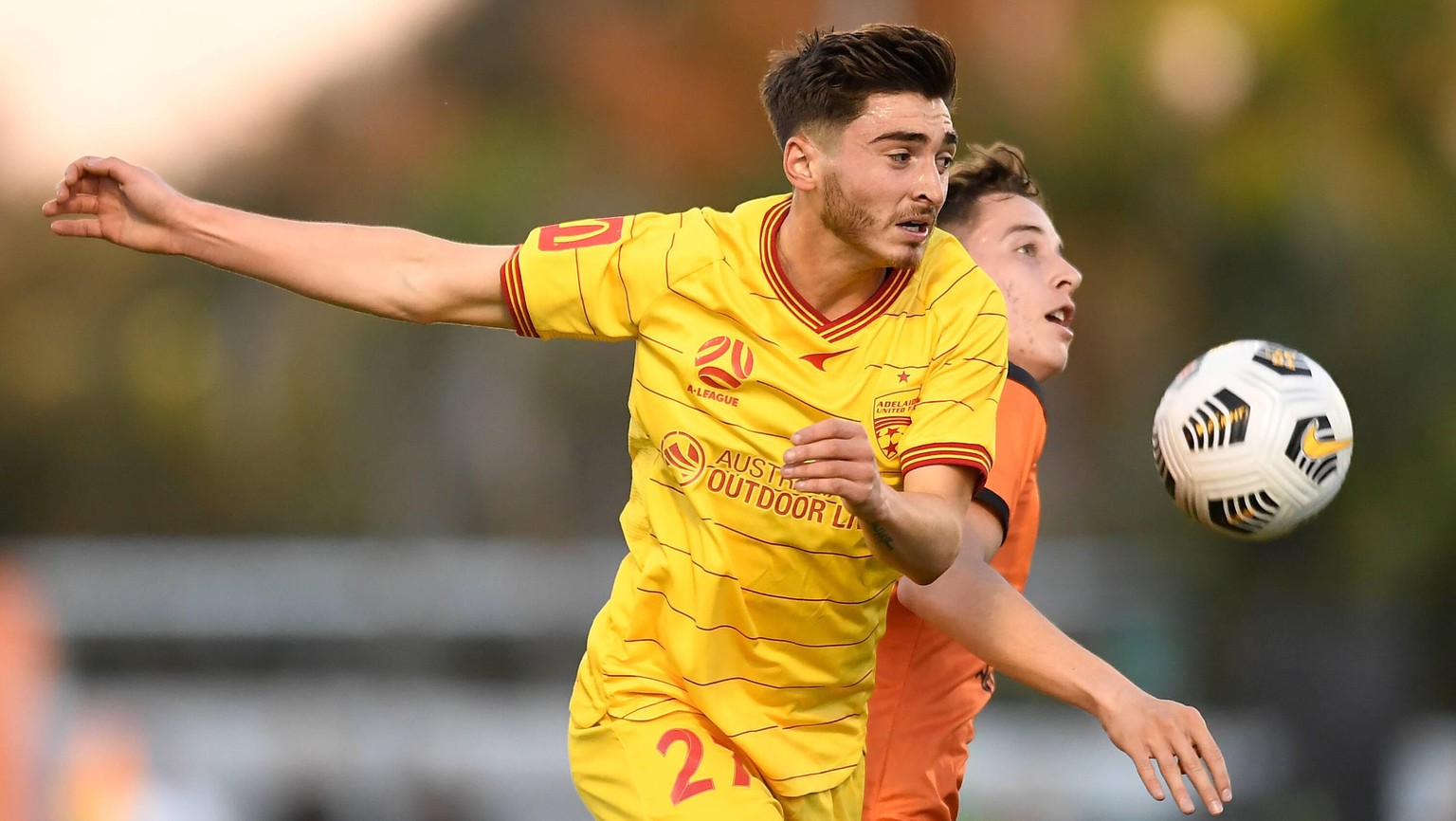 ALEAGUE ROAR ADELAIDE, Joshua Cavallo of Adelaide United and Kai Trewin of the Roar compete for the ball during the A-League Elimination Final between Brisbane Roar and Adelaide United FC at Moreton D ...