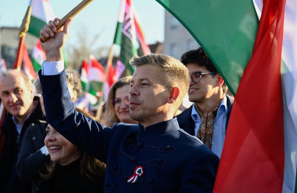 epa12821766 President of the opposition Tisza Party Peter Magyar leads the National March during the national holiday to mark the 178th anniversary of the outbreak of the 1848 revolution and war of in ...