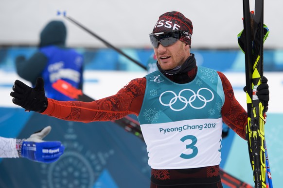 Dario Cologna of Switzerland reacts during the men Cross Country Skiing 15 km + 15 km Skiathlon during the XXIII Winter Olympics 2018 at the Alpensia Cross-Country Skiing Centre in Pyeongchang, South  ...