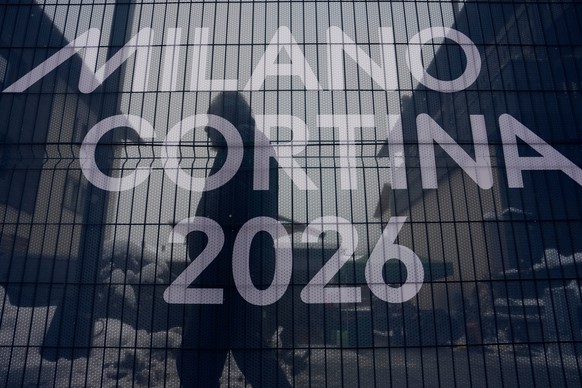 KEYPIX - A person is seen behind a netting at the 2026 Winter Olympics, in Bormio, Italy, Wednesday, Feb. 4, 2026. (KEYSTONE/AP Photo/John Locher)