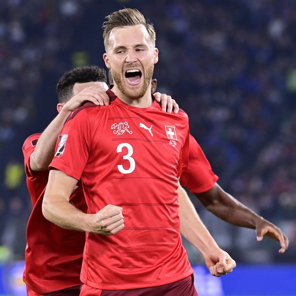 Switzerland&#039;s defender Silvan Widmer celebrates after scoring the opening goal during the 2022 FIFA World Cup European Qualifying Group C match between Italy and Switzerland at the Stadio Olimpic ...