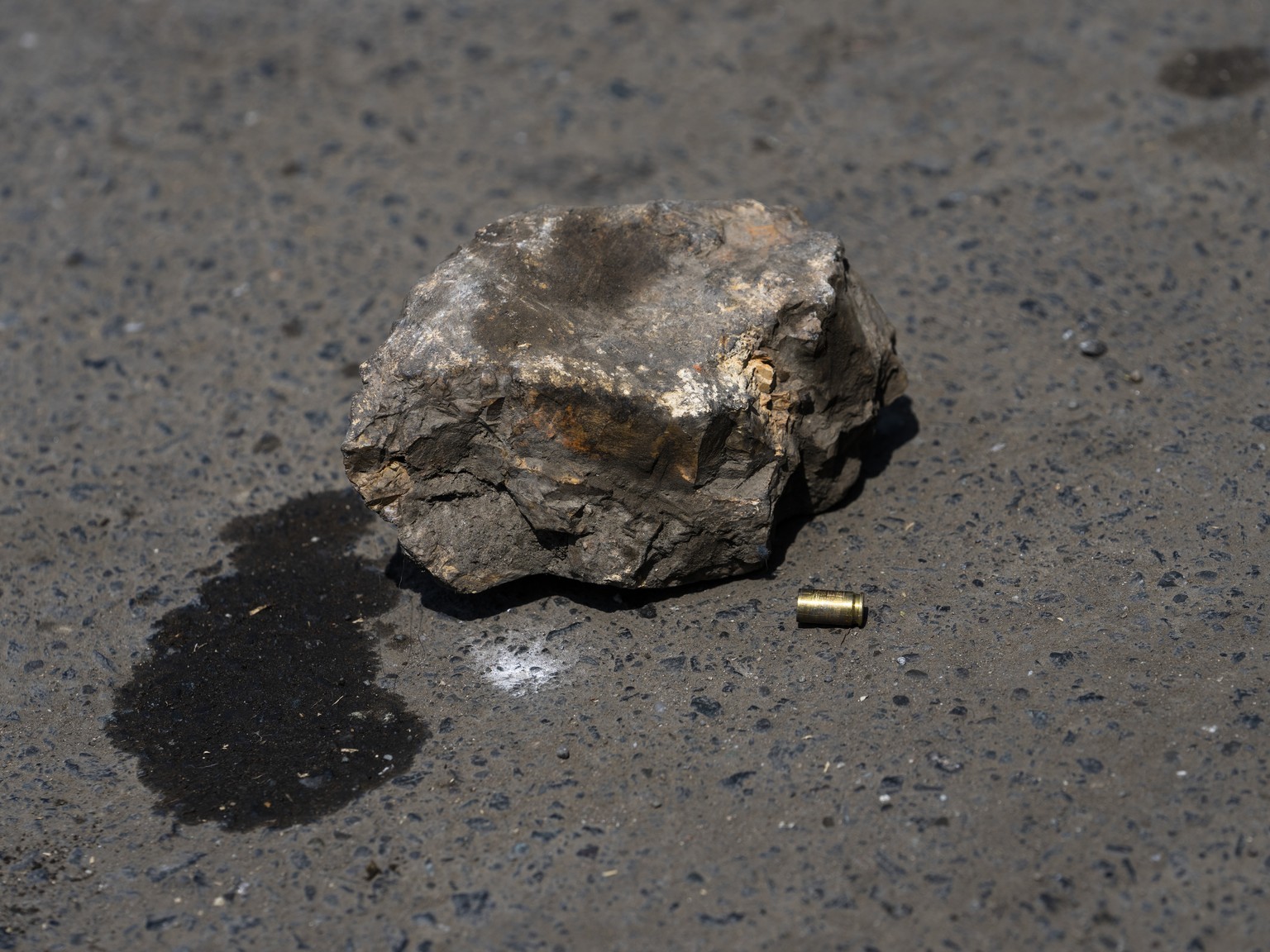 A bullet lays meters from the corpse of Juan Carlos Barrezueta, a taxi driver who was murdered when he stopped to buy something at a car parts store, in Duran, the sister city of Guayaquil, Ecuador, F ...