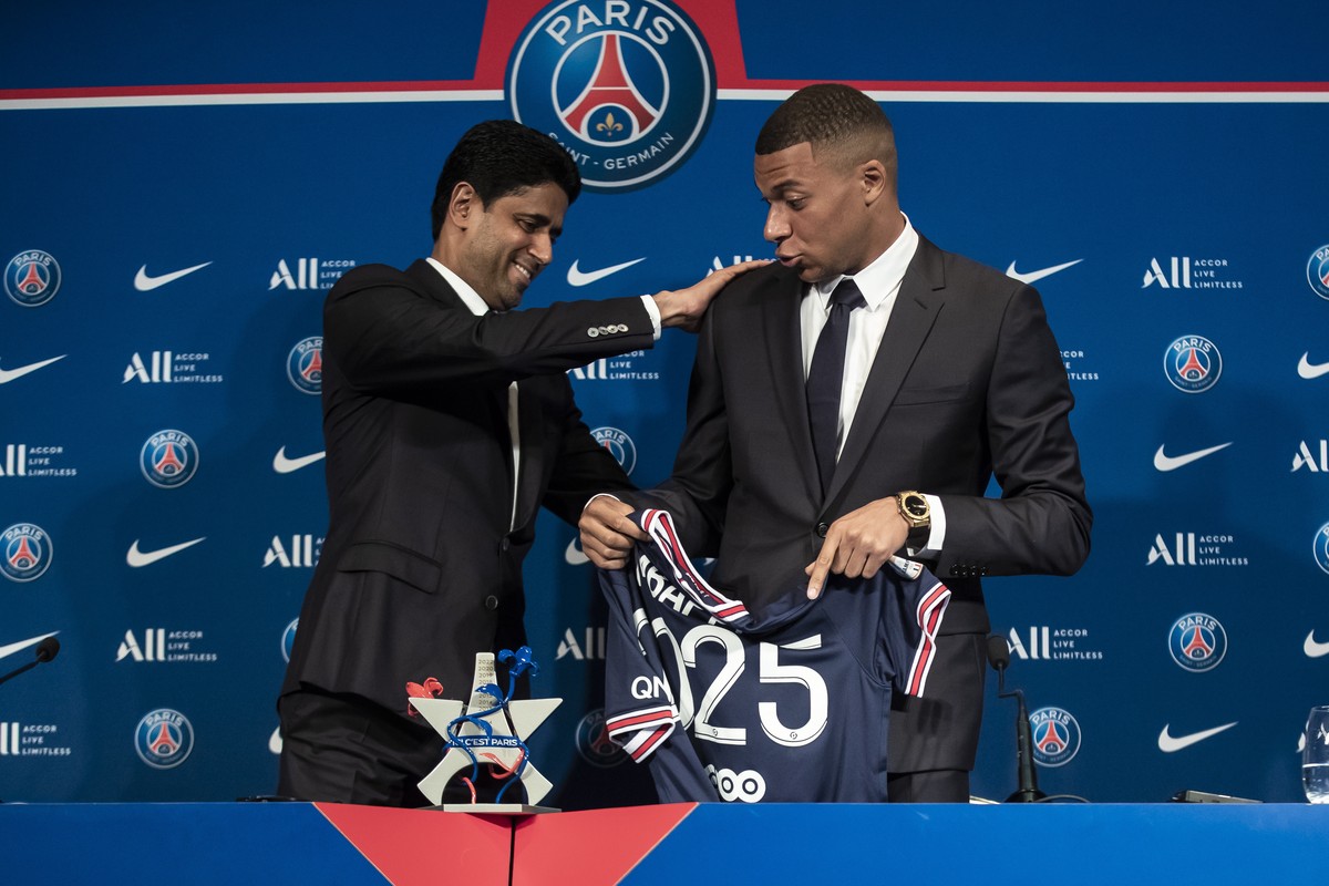 epa09969927 Paris Saint-Germain's president Nasser Al-Khelaifi (L) and Paris Saint Germain's forward Kylian Mbappe attend a press conference at the Parc des Princes stadium in Paris, France, ...