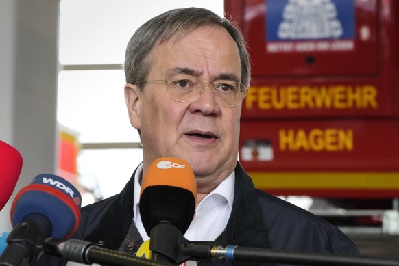 Armin Laschet, Governor of North Rhine-Westphalia and chancellor candidate of the German Christian Democrats, talks to the media at the fire station in Hagen, Germany, Thursday, July 15, 2021 after th ...