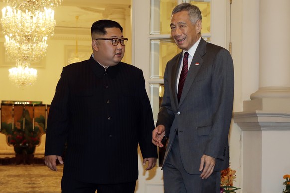 North Korean leader Kim Jong Un meets with Singapore&#039;s Prime Minister Lee Hsien Loong at the Istana or presidential palace on Sunday, June 10, 2018, in Singapore. (AP Photo/Wong Maye-E)