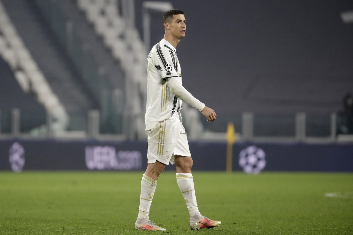 Juventus' Cristiano Ronaldo walks on the pitch at the end of the Champions League, round of 16, second leg, soccer match between Juventus and Porto in Turin, Italy, Tuesday, March 9, 2021. Juvent ...