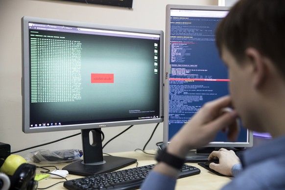 An employee of Global Cyber Security Company Group-IB develops a computer code in an office in Moscow, Russia, Wednesday, Oct. 25, 2017. A new strain of malicious software has paralyzed computers at a ...