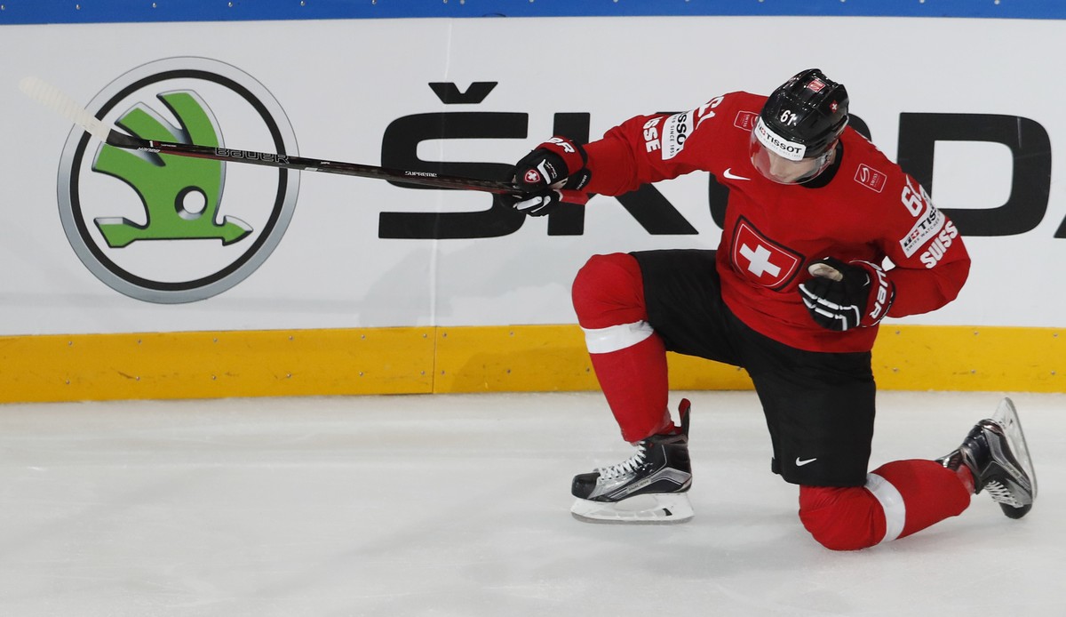 Switzerland's Fabrice Herzog celebrates after scoring his sides first goal during the Ice Hockey World Championships group B match between Switzerland and Finland in the AccorHotels Arena in Pari ...