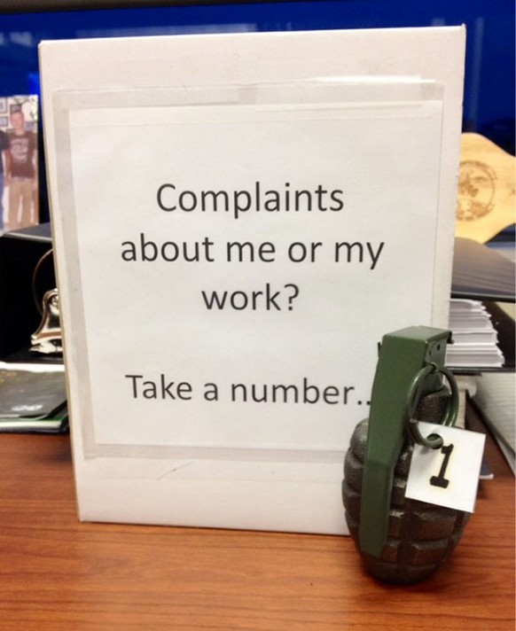 Passive-aggressive message with hand grenade