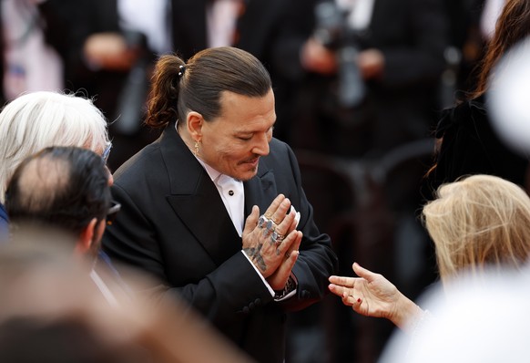 epa10632336 Johnny Depp arrives for the opening ceremony of the 76th annual Cannes Film Festival, in Cannes, France, May 16, 2023. The festival runs from May 16 to 27.  EPA/Sebastien Nogier