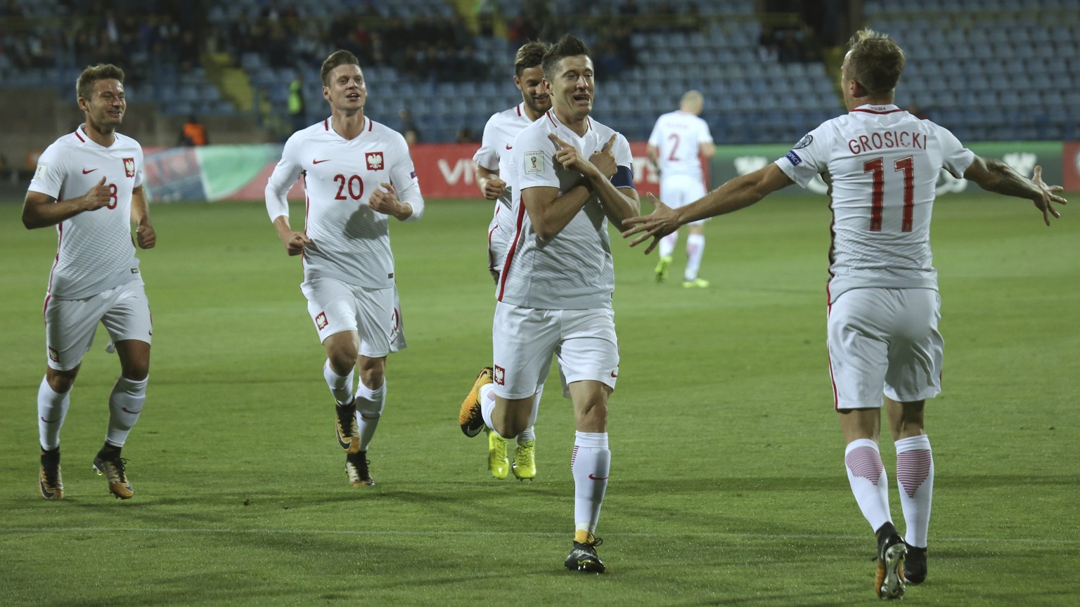 Poland&#039;s Robert Lewandowski, second from right, celebrates scoring his goal during the World Cup Group E qualifying soccer match between Armenia and Poland in Yerevan, Armenia, Thursday, Oct. 5,  ...