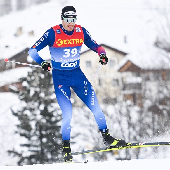 epa08913862 Dario Cologna of Switzerland in action during the Men&#039;s Sprint Free qualification of the first stage of the Tour de Ski, in Tschierv, Val Muestair, Switzerland, 01 January 2021. EPA/G ...