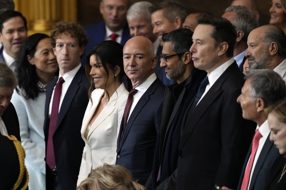 Guests including Mark Zuckerberg, Jeff Bezos, Sundar Pichai and Elon Musk, arrive before the 60th Presidential Inauguration in the Rotunda of the U.S. Capitol in Washington, Monday, Jan. 20, 2025. (AP ...