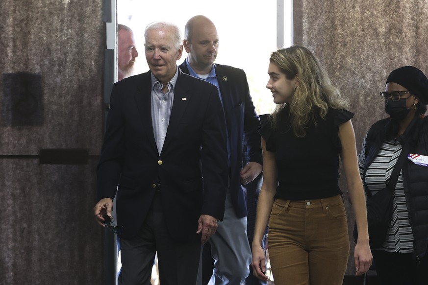 President Joe Biden arrives to cast his vote during early voting for the 2022 U.S. midterm elections with his granddaughter Natalie Biden, a first-time voter, at a polling station in Wilmington, Del., ...